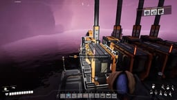 Satisfactory coal-powered generator with a Press E to configure prompt showing the generator array under a pink sky