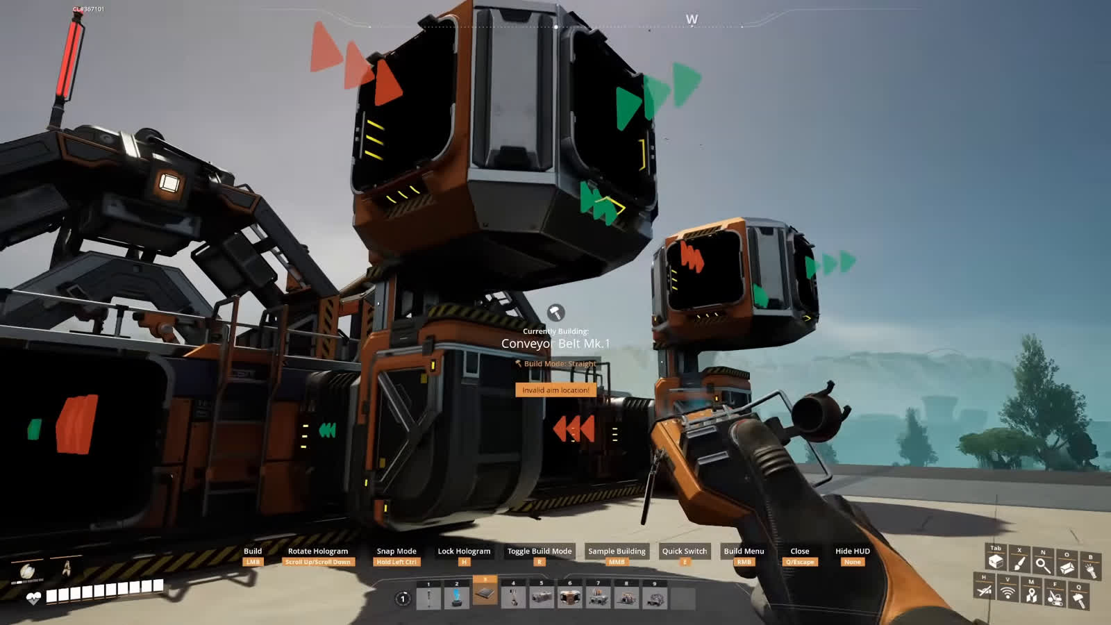 Satisfactory first-person view building a Conveyor Belt Mark 1 between two industrial assembler machines with input and output direction arrows visible