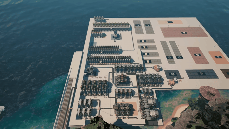 Satisfactory factory part-way through construction, with finished machine blocks next to empty colour-coded foundation pads