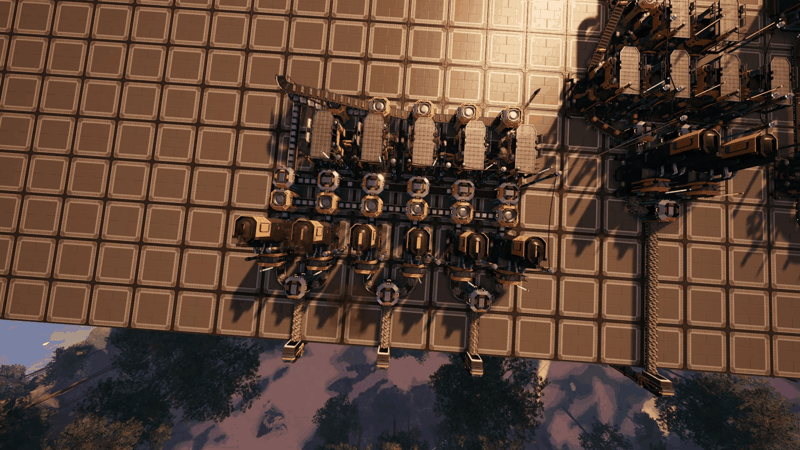 Overhead view of a large Satisfactory iron factory with a row of smelters feeding constructors and assemblers, linked by conveyor belts and lifts on a foundation platform