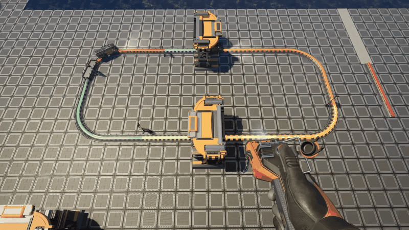 Satisfactory rail loop with the signal build tool equipped, showing each signal block coloured differently in red, cyan, green, yellow and pink between two train stations.