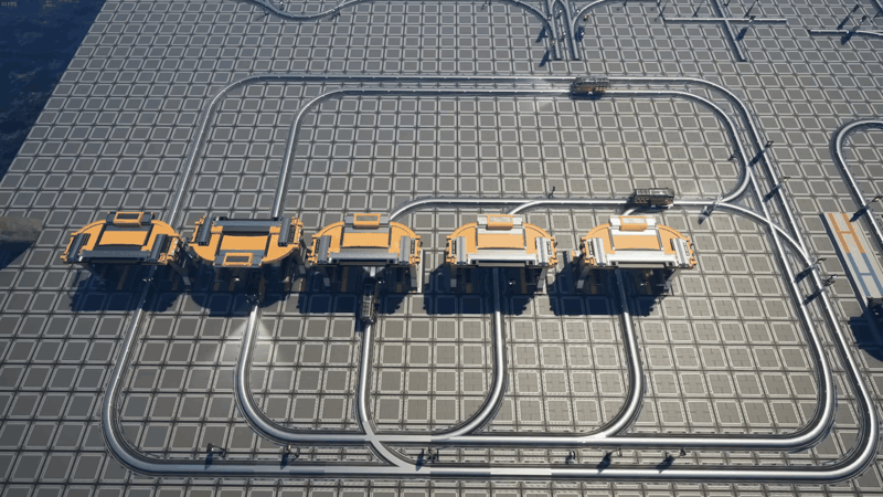 Overhead view of a Satisfactory dual-line train network: two parallel circuits running in opposite directions, linked together and feeding a row of four freight stations.