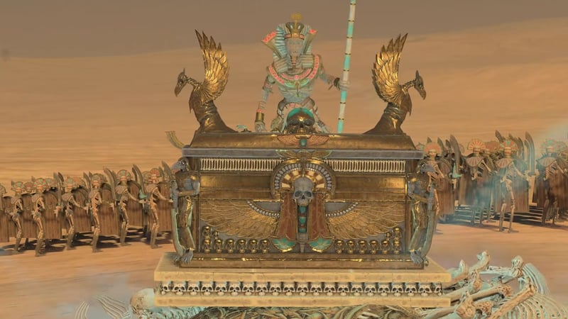 Casket of Souls unit from the Tomb Kings faction in Total War: Warhammer, positioned in front of skeleton infantry in a desert setting.