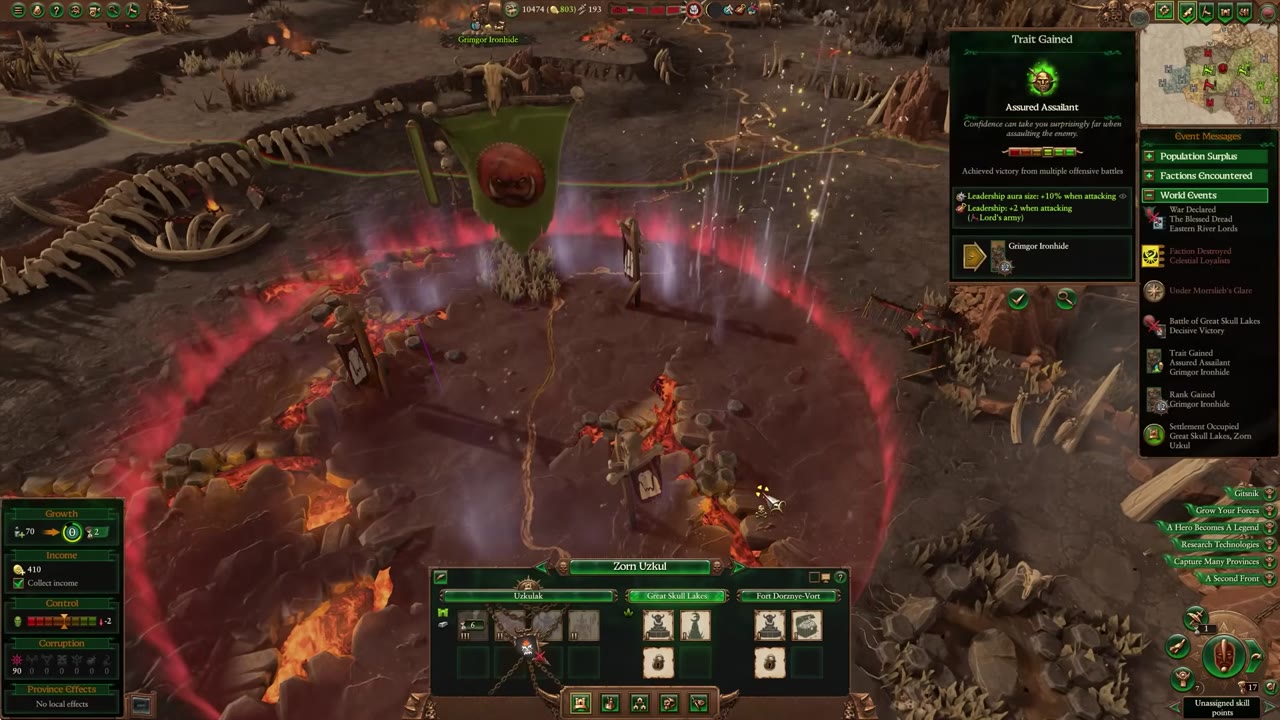 Campaign map view with mountain terrain, settlement Zorn Uzkul selected, army Grimgor Ironhide near a red aura zone, and movement paths visible.