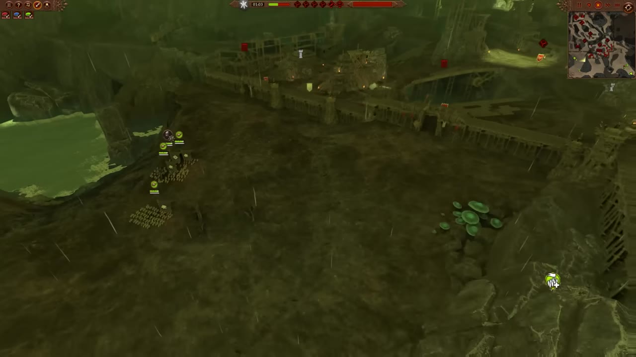Battlefield view showing a small group of units with green icons advancing toward a fortress gate, separated from the rest of the army.