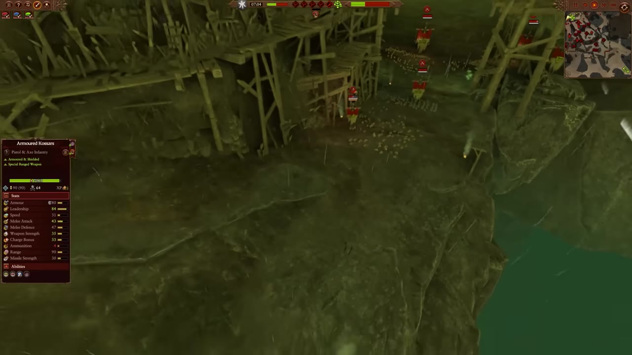 Victory point area with the green progress bar filling toward halfway at the top of the screen, Armoured Kossars unit details on the left, enemy Skaven units approaching from the right.