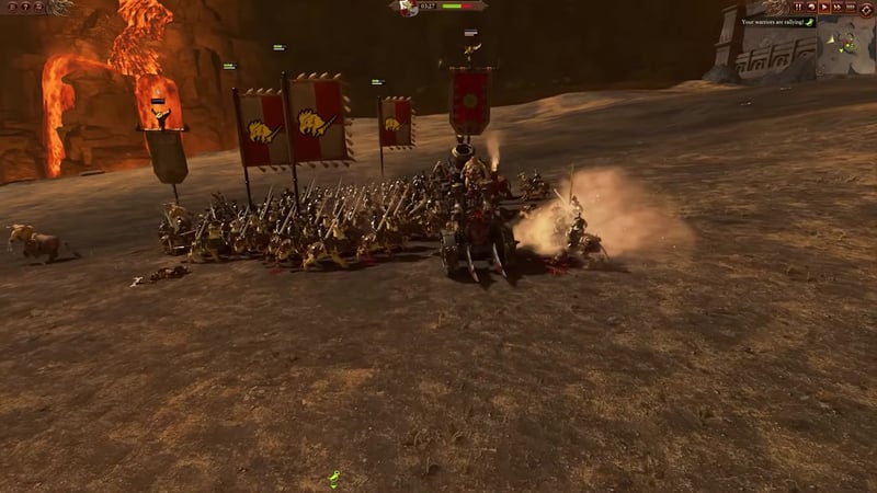 Battlefield view showing several melee units surrounding and attacking a large enemy artillery piece, with unit banners visible.
