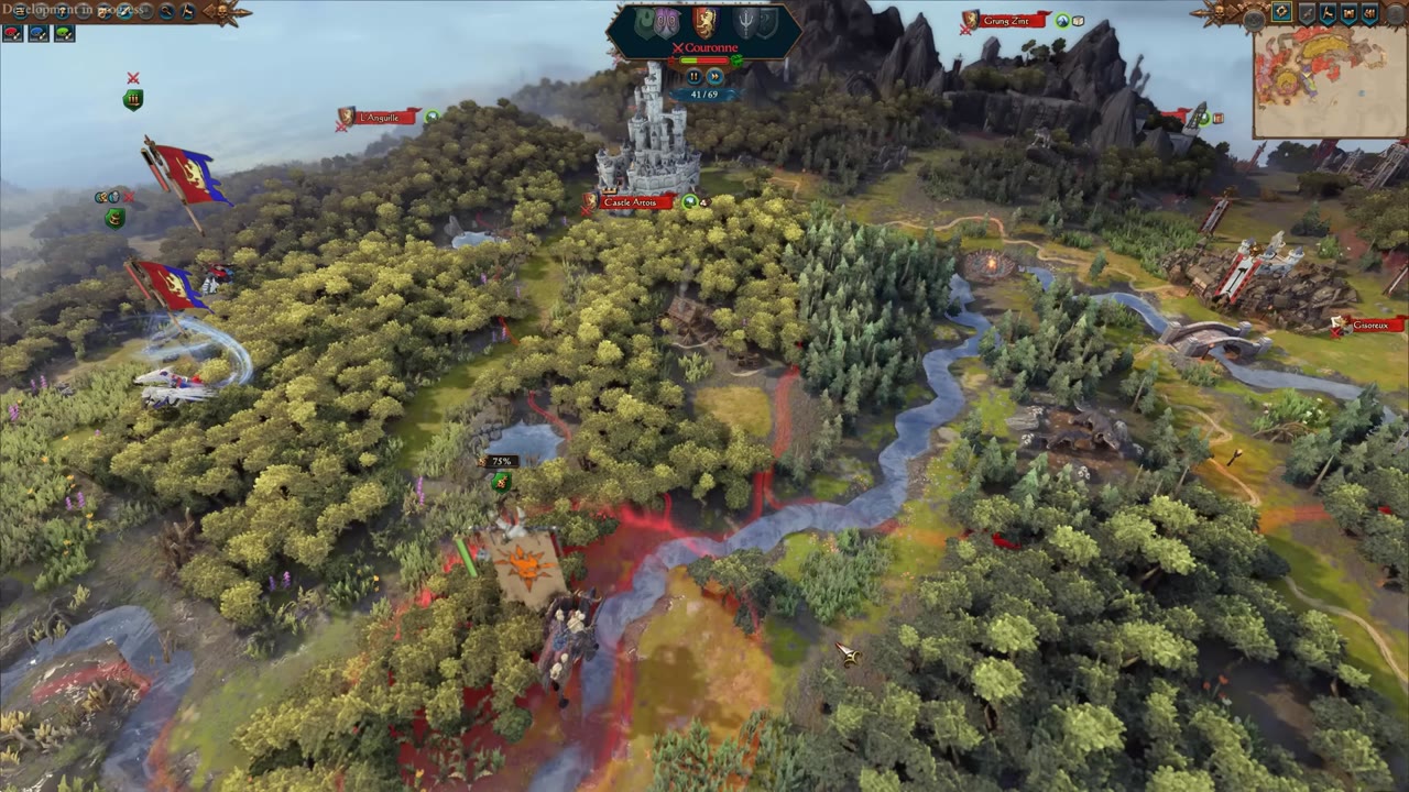 Strategic map view with a river splitting the terrain; an army in ambush stance with a 75% hidden chance is positioned near the river, enemy armies and castles are visible adjacent to the far bank.