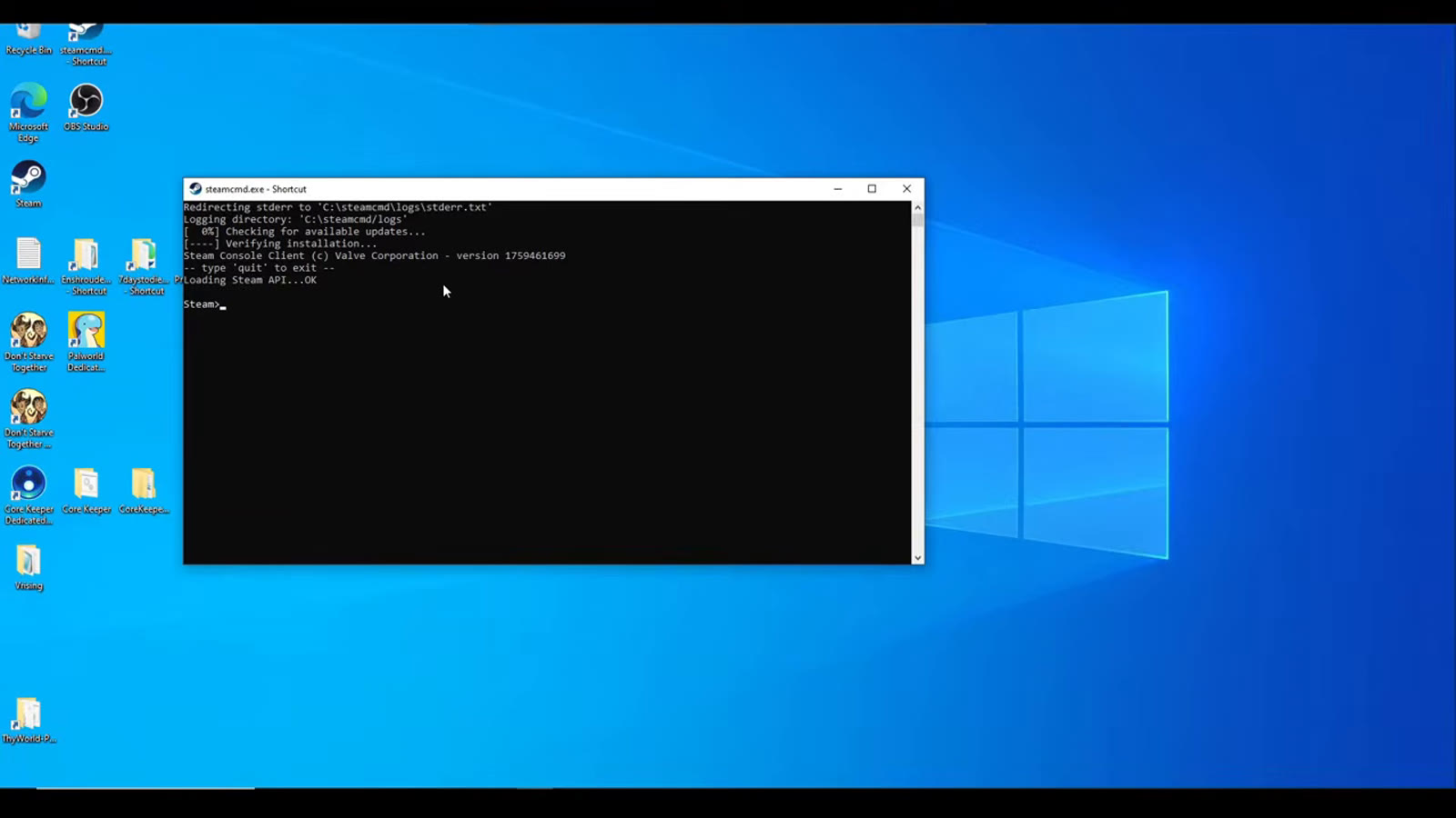 A SteamCMD command-line window running the app_update command to download and validate the Satisfactory Dedicated Server files