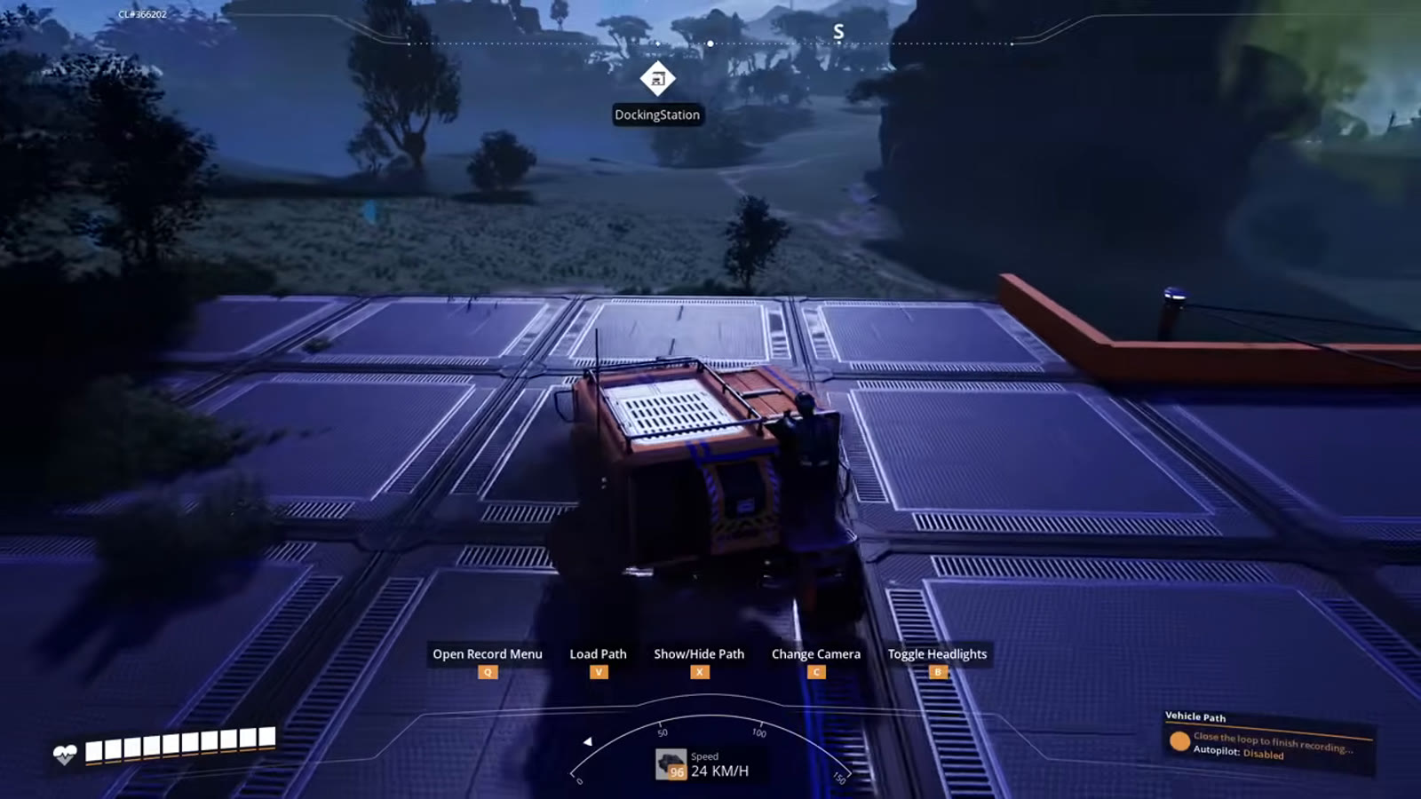 The player driving the recorded loop a second time, watching for the truck's own previous route markers to confirm the path was captured correctly