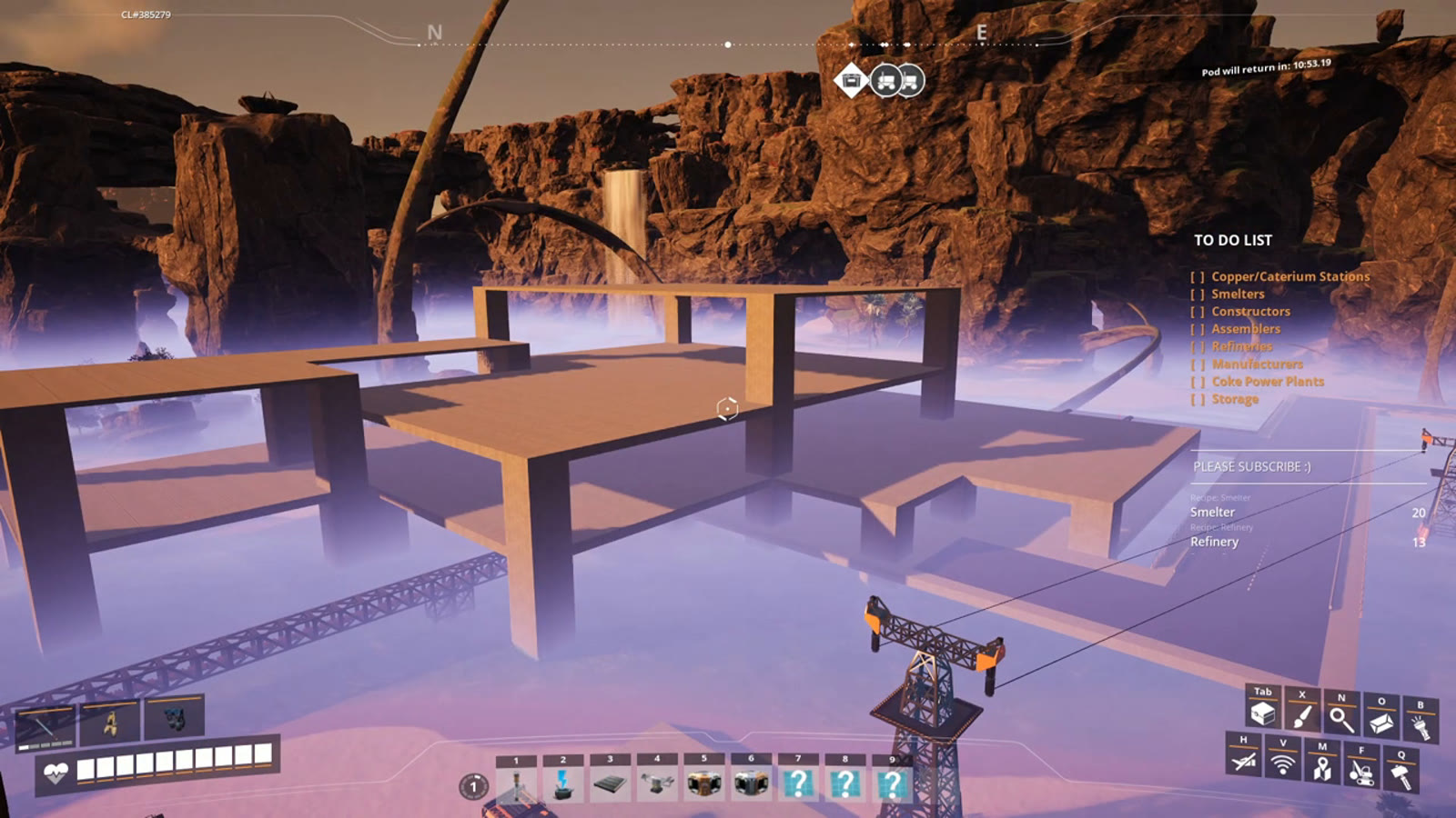 A pre-built factory frame beside an existing oil facility, laid out in advance with floors mentally assigned to different machine types before construction starts