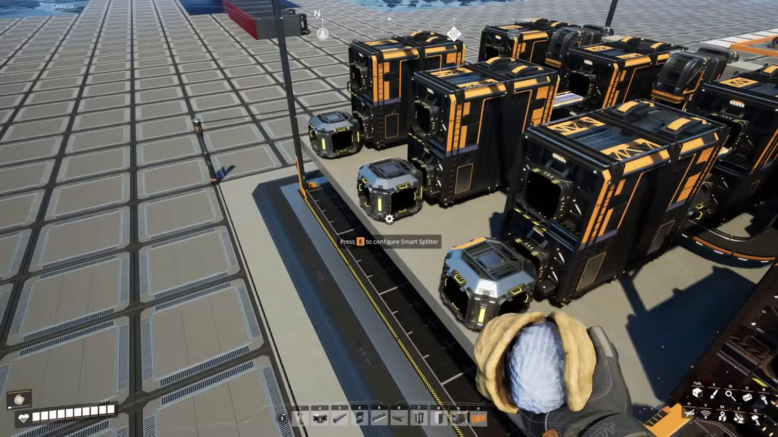 A shared overflow belt running past multiple Smart Splitters, each grabbing its own dedicated item and passing the rest along toward an AWESOME Sink