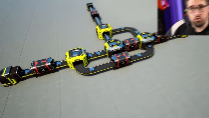 A splitter array pulling exactly one machine's worth of iron ingots out of the main line to solve a prime-number split