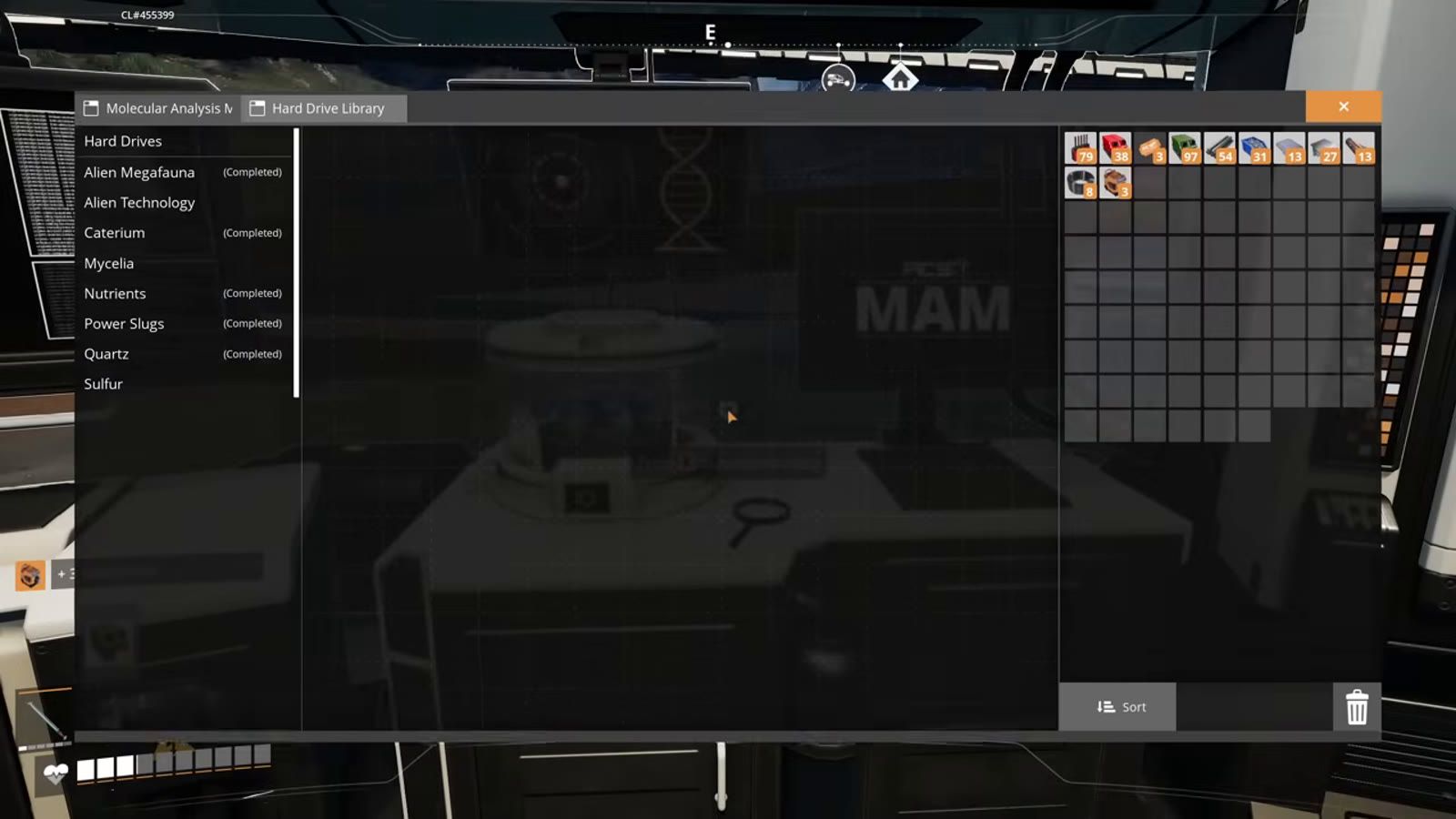 Feeding a Hard Drive into the MAM to scan it and reveal recipe rewards