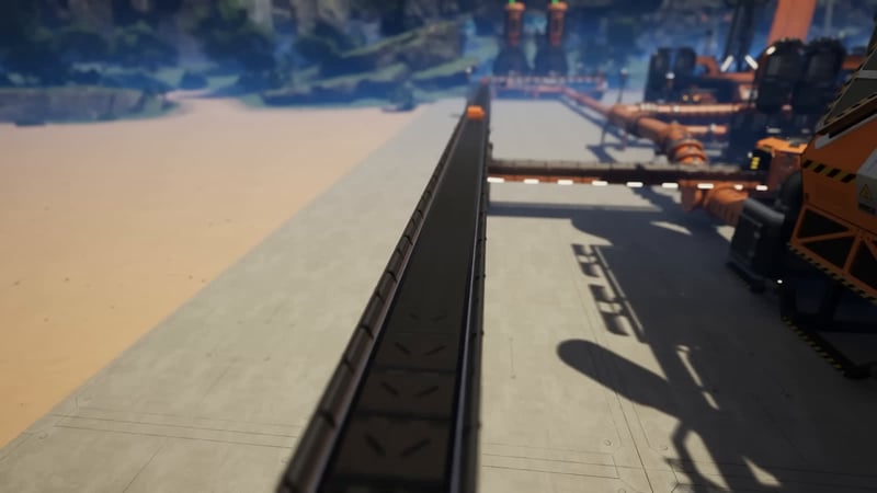 Satisfactory first-person view walking alongside a conveyor belt toward a large industrial refinery complex with orange piping