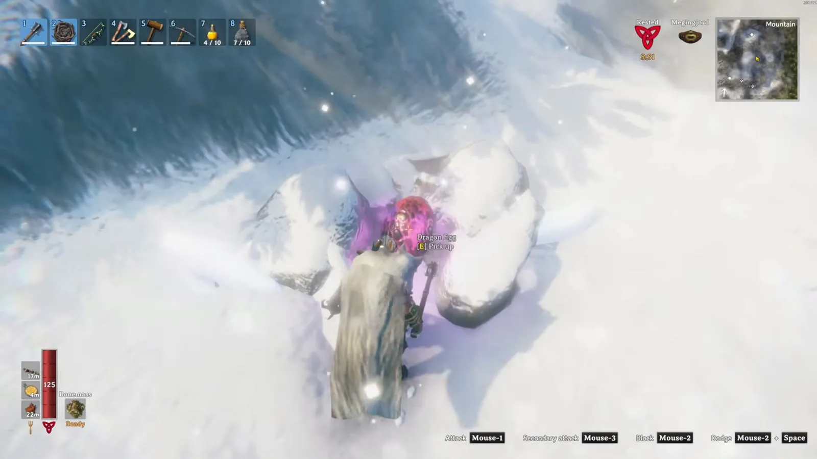 A Valheim player picking up a pink Dragon egg from a Drake nest in the snowy Mountains