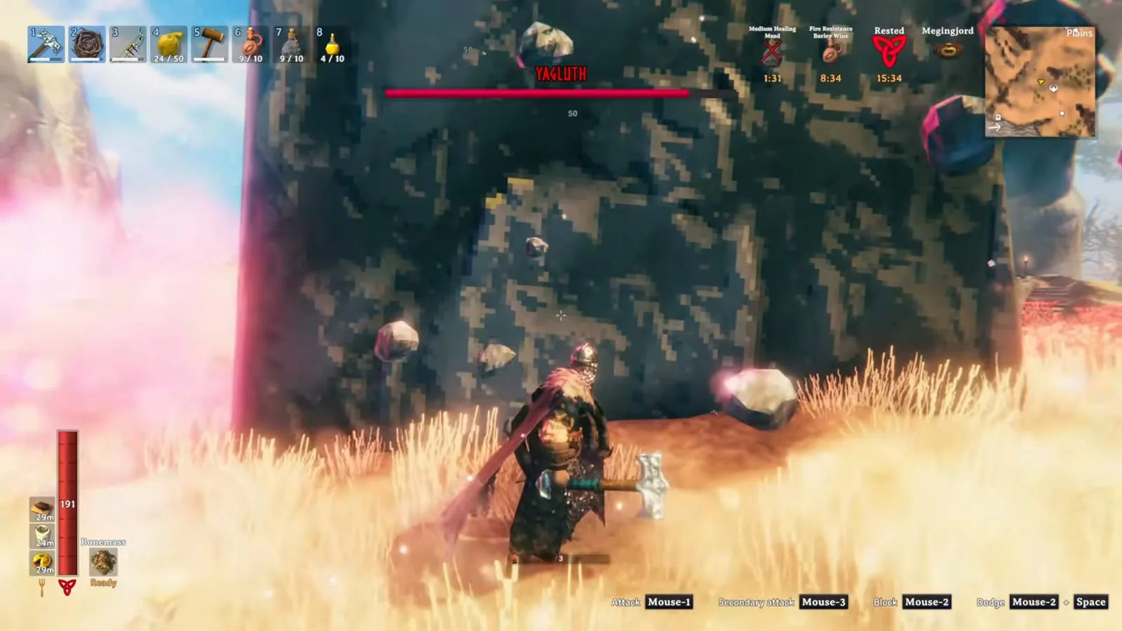 Player sheltering behind a stone pillar while Yagluth's meteors fall around the arena