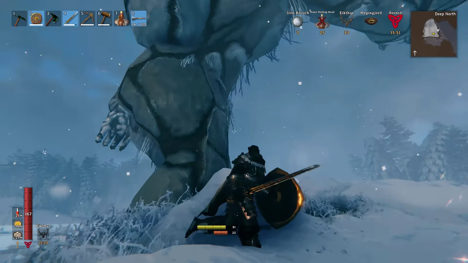 Player fighting under the legs of a Gammeltroll in the Valheim Deep North