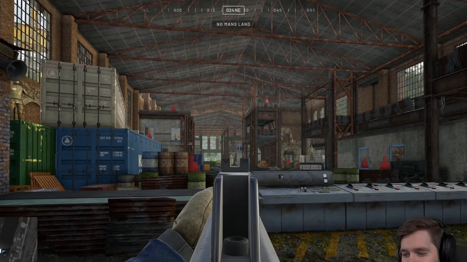 WARDOGS faction starter rifle held in the firing range warehouse