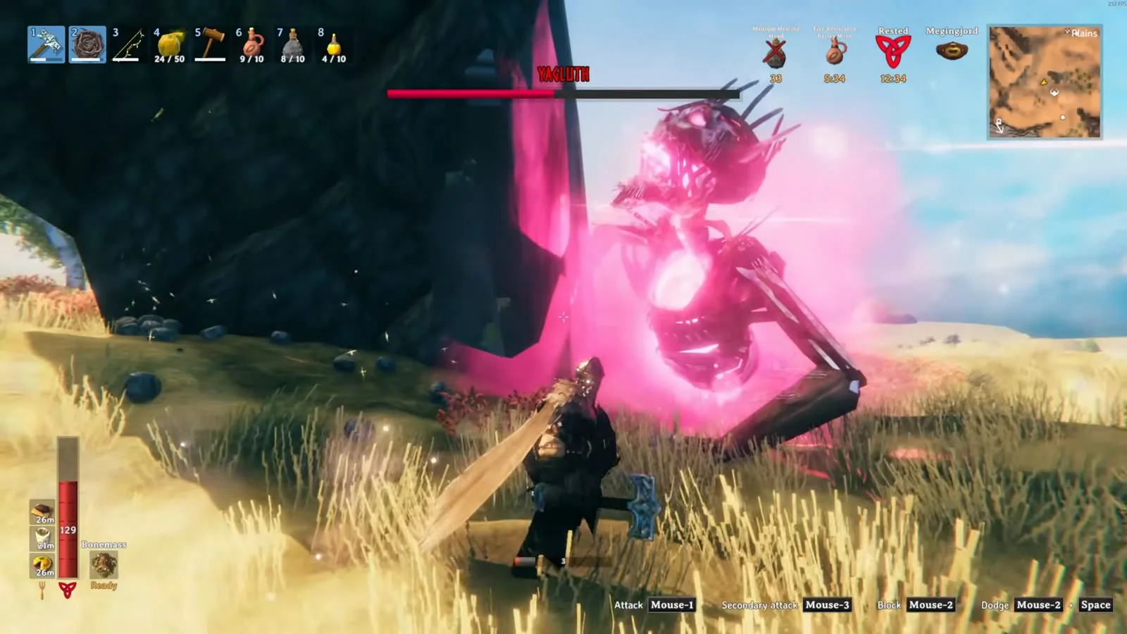 Yagluth up close beside a stone pillar while the player attacks with a mace and shield