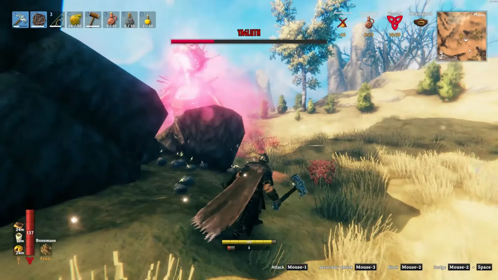 Player with a mace closing in on Yagluth near a boulder after his nova slam