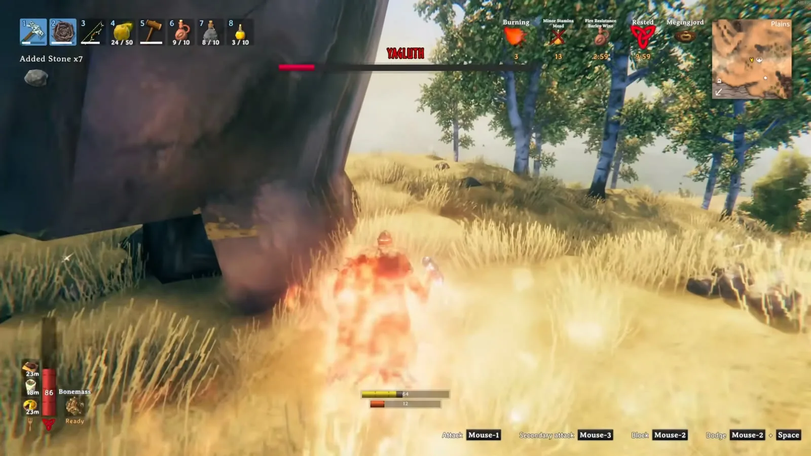 Player on fire fighting Yagluth at low health next to a pillar, barley wine timer showing