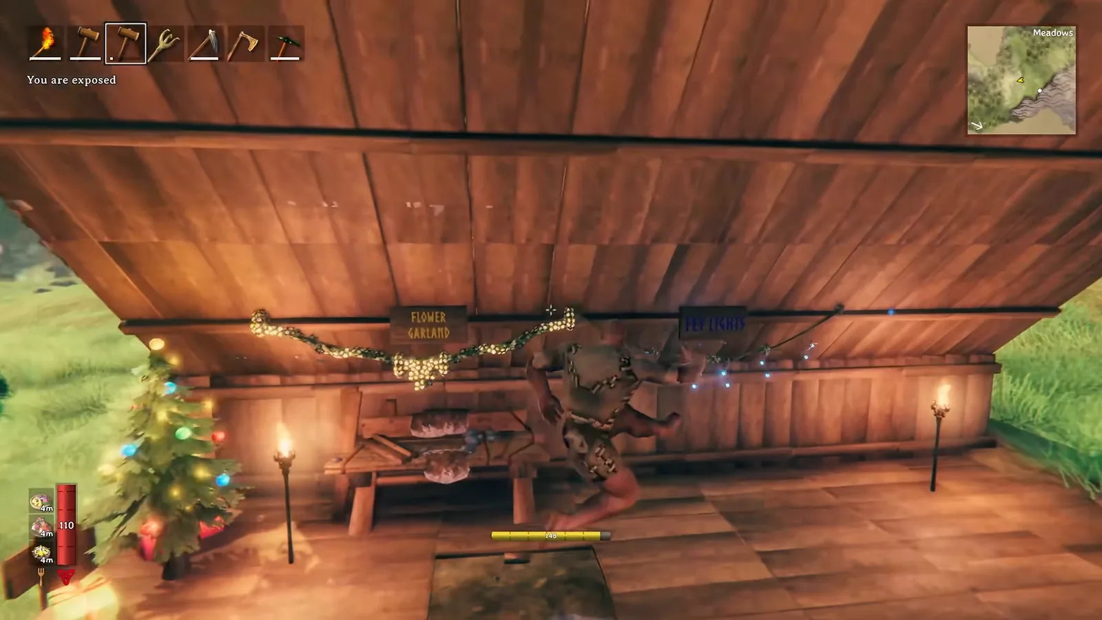 Valheim room with a Yule Tree, Flower Garland and Fey Lights for comfort