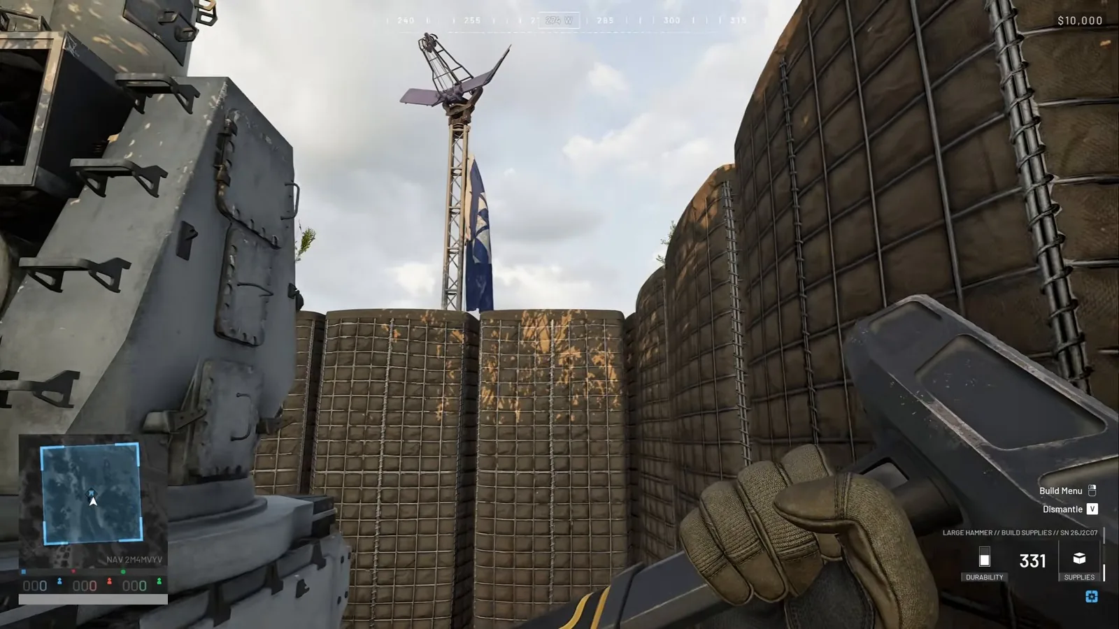 WARDOGS CIWS inside a ring of Hesco walls on top of a mini FOB shelter