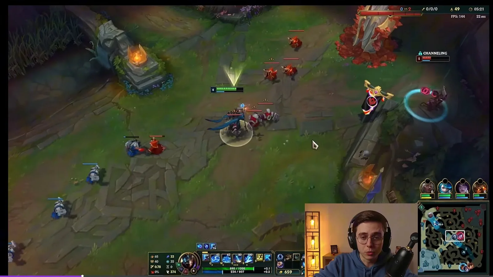 Mid laner stepping up while the enemy laner channels recall to cancel it